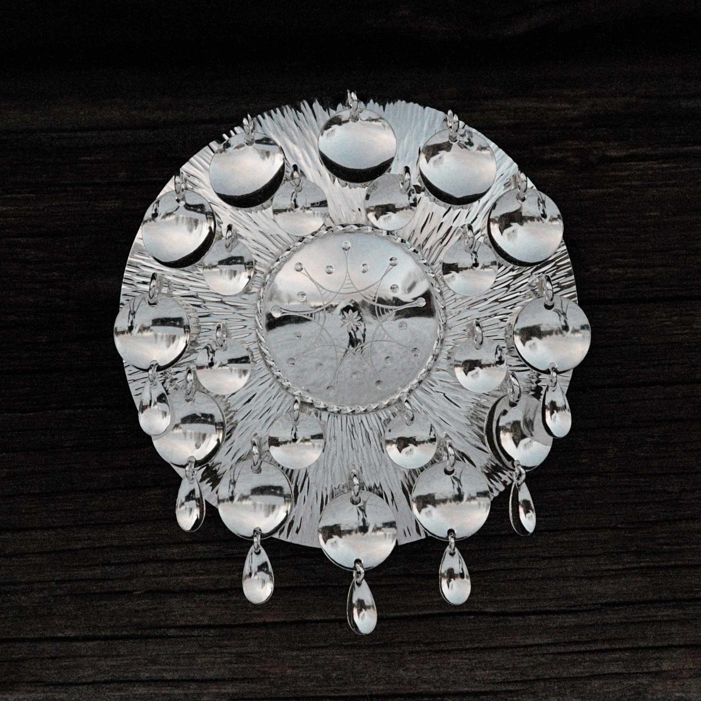 Brooch 8 cm, radial hammering, engraved silver decoration